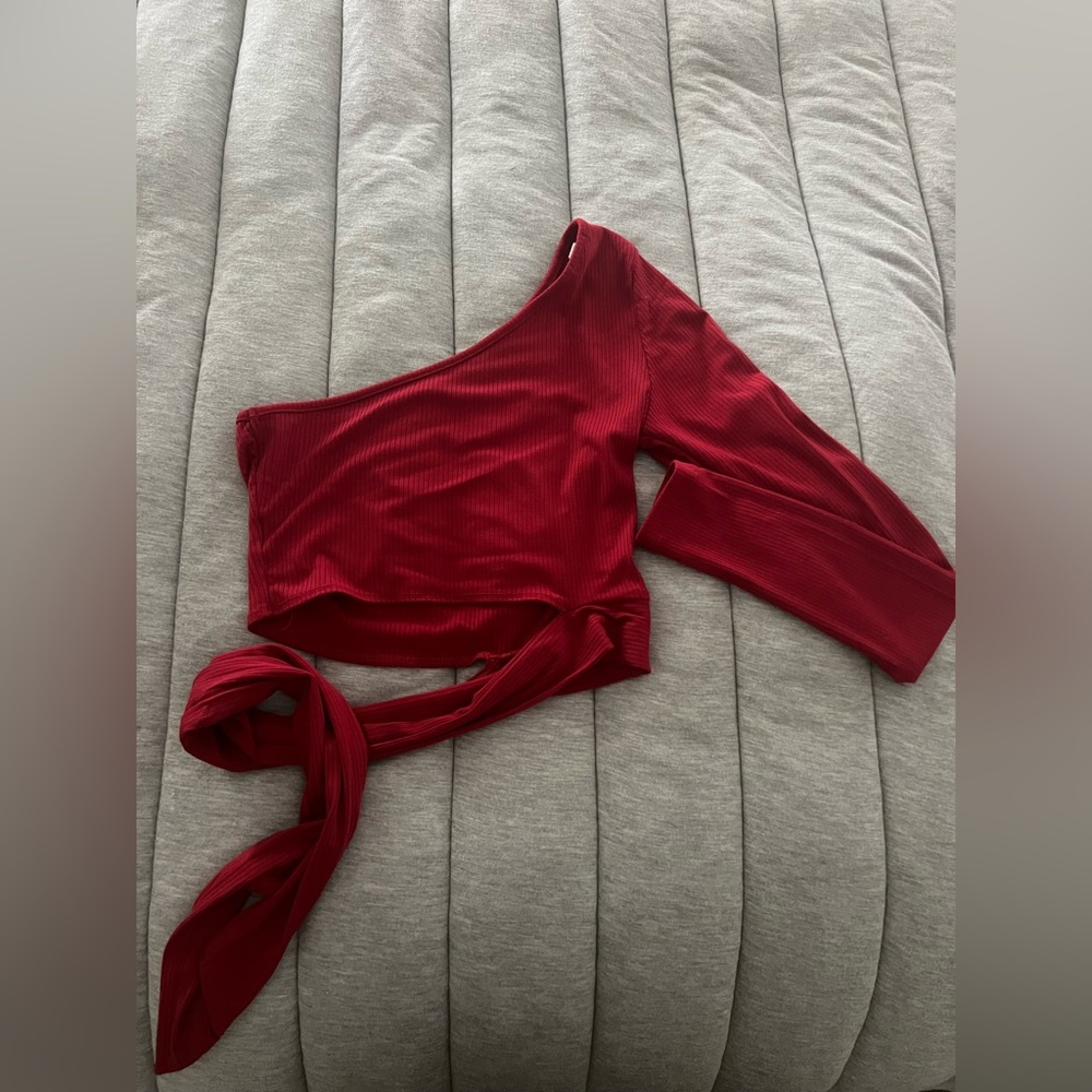red one shoulder long sleeve top, cropped, with ties on the side